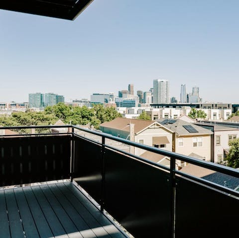 Sip pre-dinner drinks on the terrace, overlooking Denver's built-up skyline