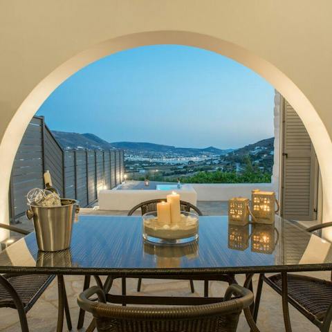 Watch glorious rolling country views of Paros from the dinner table