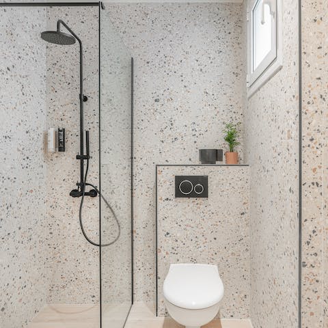 Start your mornings with a luxurious soak under the bathroom's rainfall shower