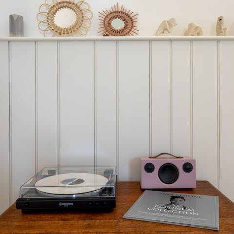 Put a record on the vinyl player or listen to music on the Bluetooth speaker