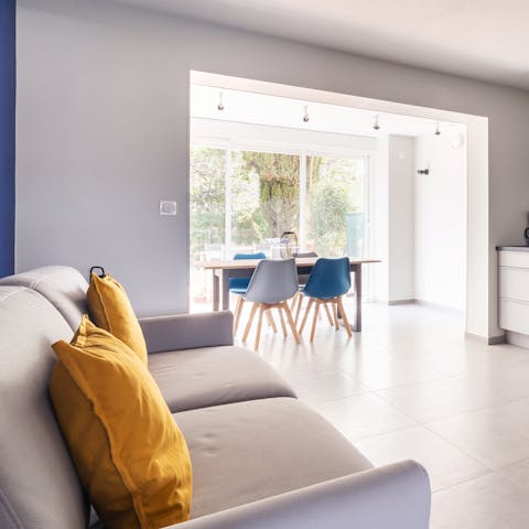 Chill out with a glass of wine on the sofa or gather around the dining table at meal times