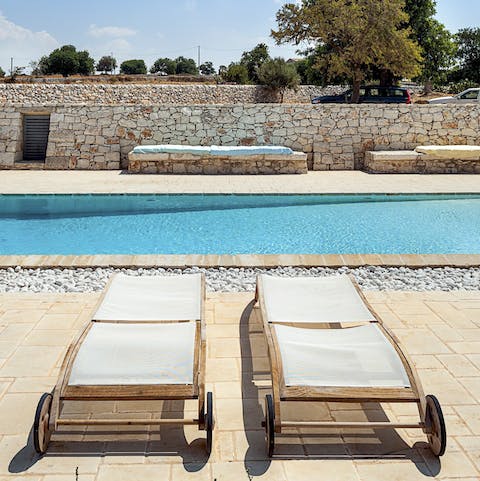 Soak up some vitamin D from the poolside loungers