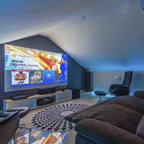 Get cosy in the home cinema room