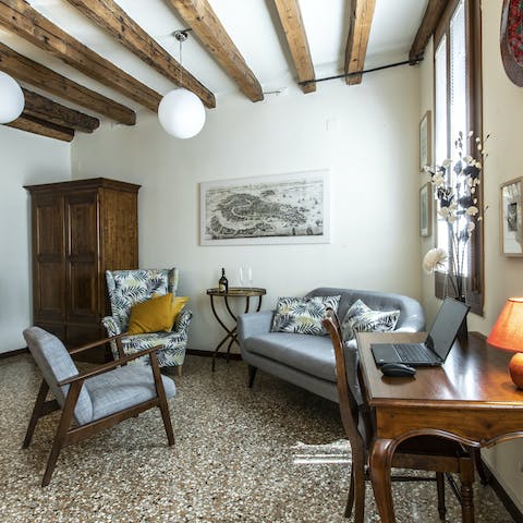 Relax in the rustic Venetian living space or tap away on your laptop at the desk