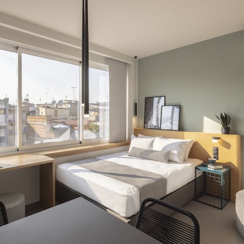 Wake up to city views from the window-side bed