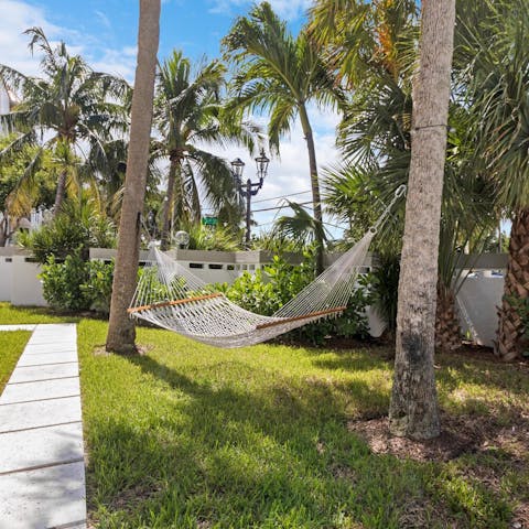 Chill out with a good book in the communal garden's hammock