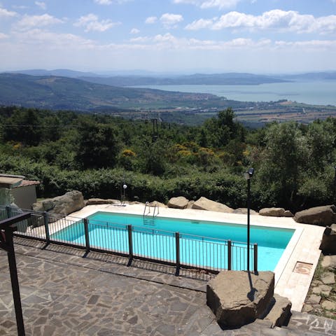 Admire the breathtaking Italian countryside from the private pool