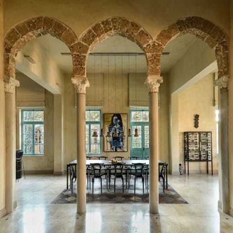 Enjoy formal dining by the preserved arches in an open-plan living space