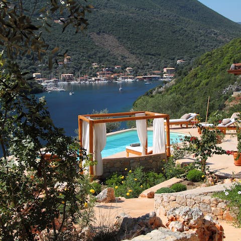 Admire beautiful views of Sivota bay from the outdoor day bed