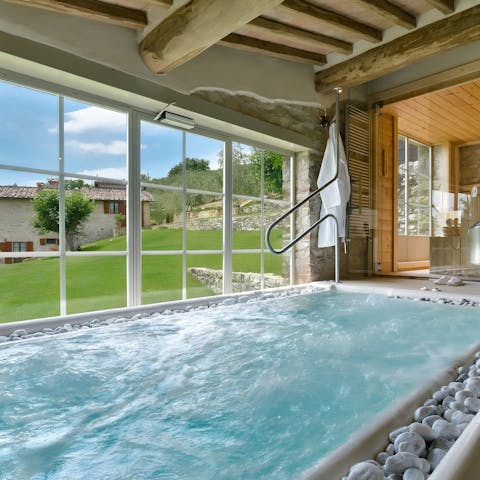 Slip into the indoor hot tub for a soak overlooking the garden