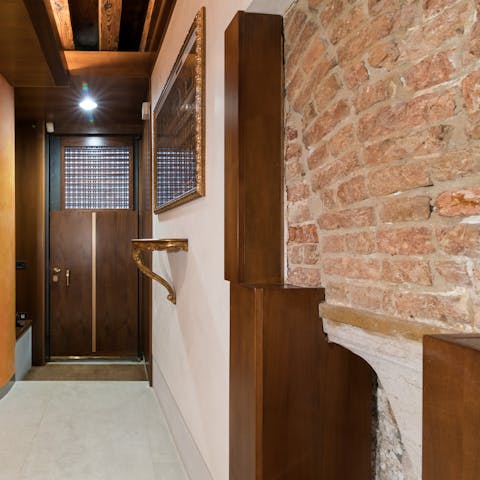 Be enraptured by the home's distinct features, like this exposed brickwork