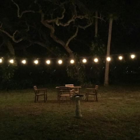 Sit under the string lights in the garden  for magical evenings together 