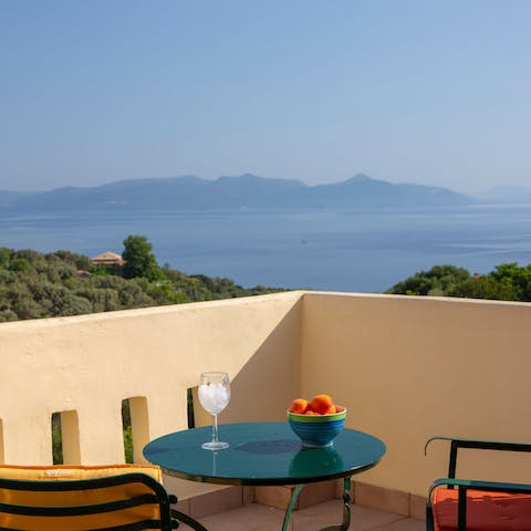 Enjoy cocktails on the balcony, admiring the sweeping views out to sea