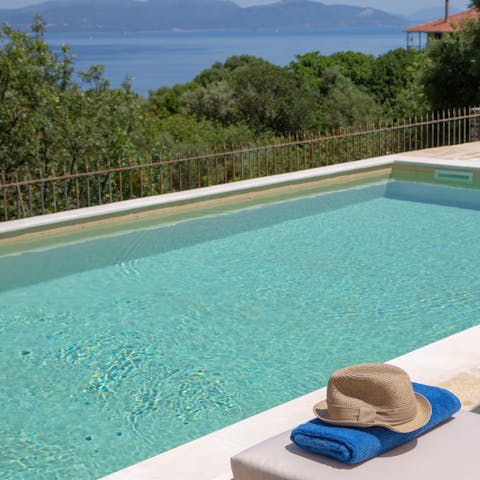 Cool off with a refreshing dip in the pool before relaxing on a sun lounger