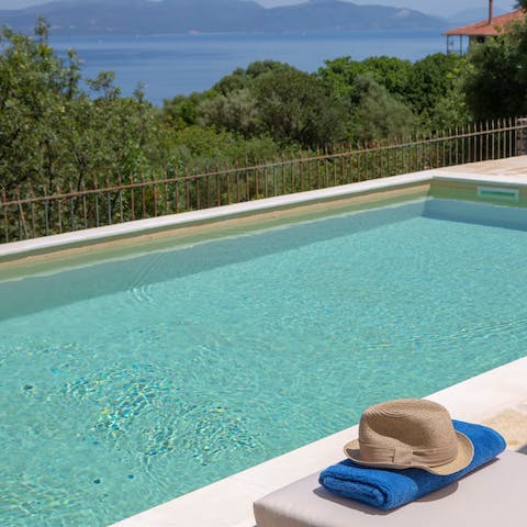 Cool off with a refreshing dip in the pool before relaxing on a sun lounger