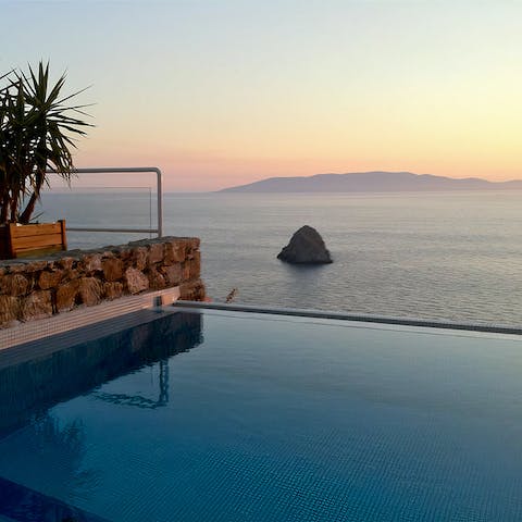 Watch the glimmering sunset from the infinity pool