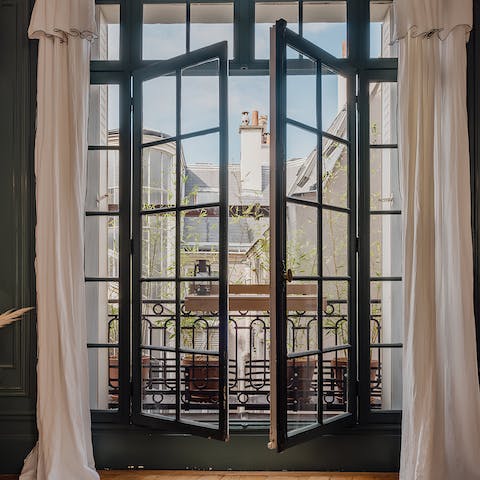 Look out across the Juliet balcony as you sip your morning espresso