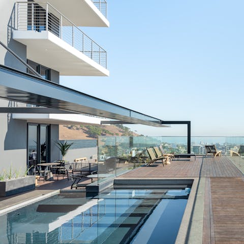Take a dip in the shimmering communal pool on the building's 27th floor