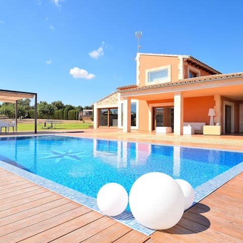 The pool is a highlight of this home, with plenty of space to swim, sunbathe, and relax.