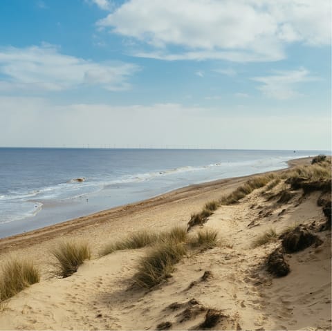 Drive twenty-five minutes to the Norfolk coast for some sand and sun