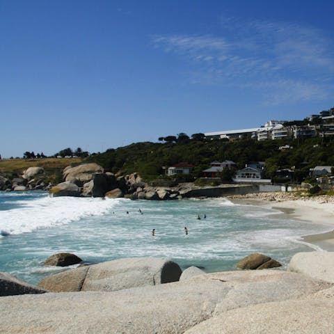 Stroll along the white sands of Camps Bay Beach and cool off in the turquoise water