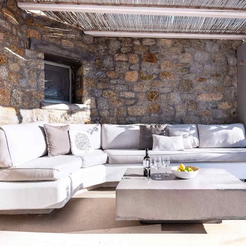Gather on the outdoor sofas for shaded seclusion
