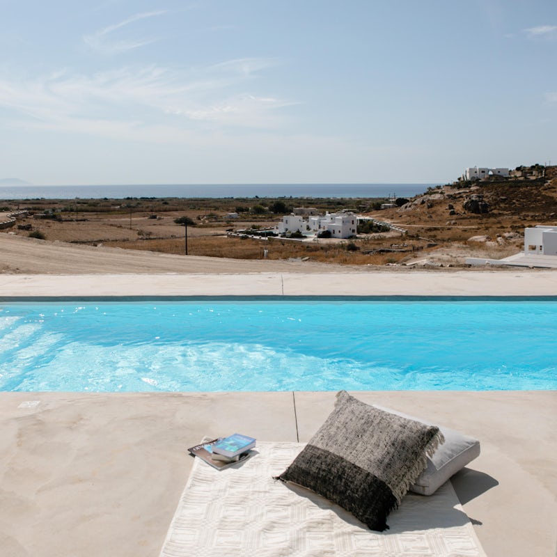 Relax by the private pool with views out to the Aegean Sea