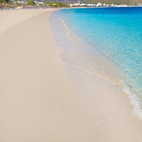 Spend the day on the warm sands of Port de Pollença, an eleven-minute drive away