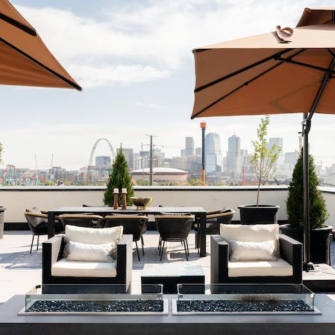 Watch the sunset and admire the skyline on the shared roof terrace