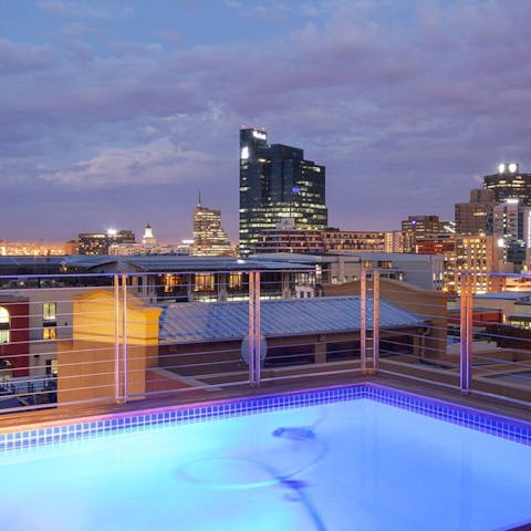 Watch the sun set over Cape Town from the stunning rooftop pool