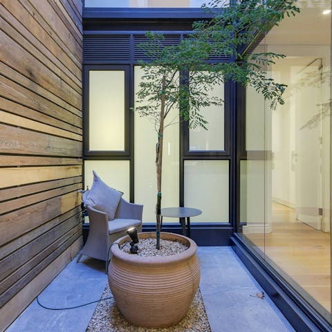 Enjoy a peaceful moment in the enclosed courtyard