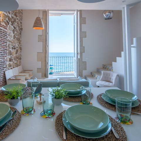 Gather at the table for breakfast as you drink in the sea views