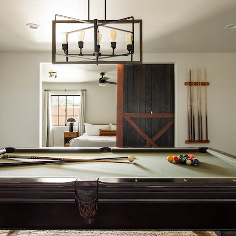 Get competitive on the billiards table in the games room