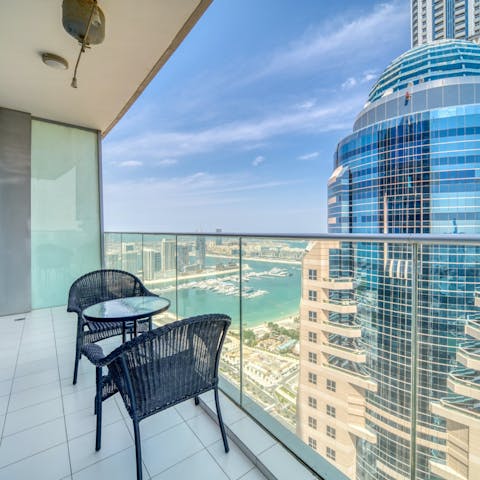 Marvel at views over the marina from the private balcony