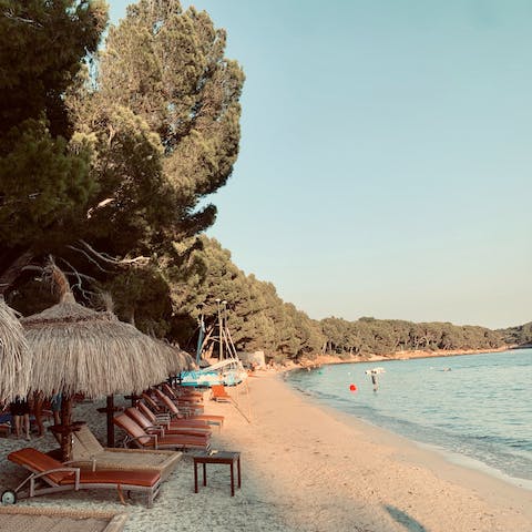 Lay out on a lounger and enjoy the beauty of Cala Formentor, twenty-five minutes away