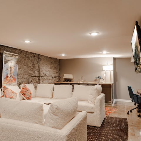 Enjoy a night of movies in the lavish entertainment room