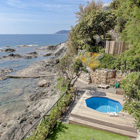 While away the day hopping between the private plunge pool and sea