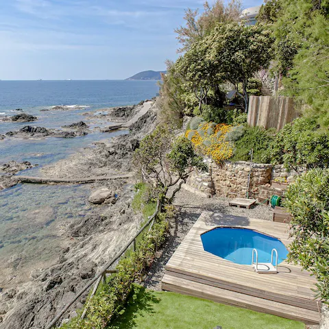 While away the day hopping between the private plunge pool and sea