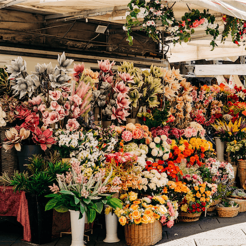 Pick up some flowers on Las Ramblas, a ten-minute walk from this home 