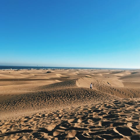 Feel the sand beneath your feet at Maspalomas’ beach and dunes – just an eight-minute drive away