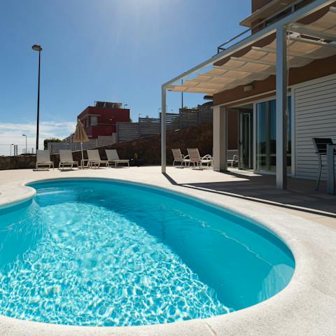 Unwind after a day playing golf with a dip in your private pool