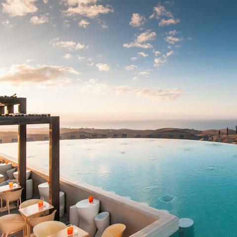 Make sunset cocktails in the shared infinity pool your only firm plan for the day