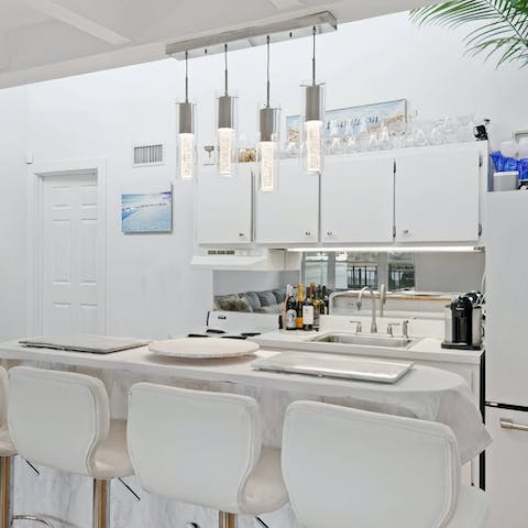 Pick up some fresh seafood from the local market and rustle up a delicious dinner in the glossy white kitchen