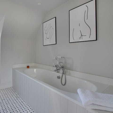 Get squeaky clean in the home's elegant bathtub