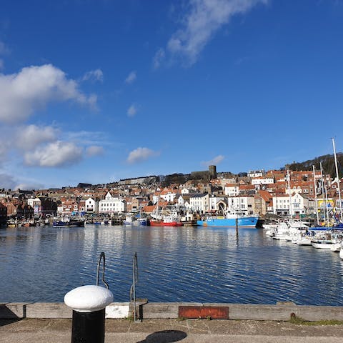 Stroll around Scarborough's marina, feeling the sea breeze on your skin