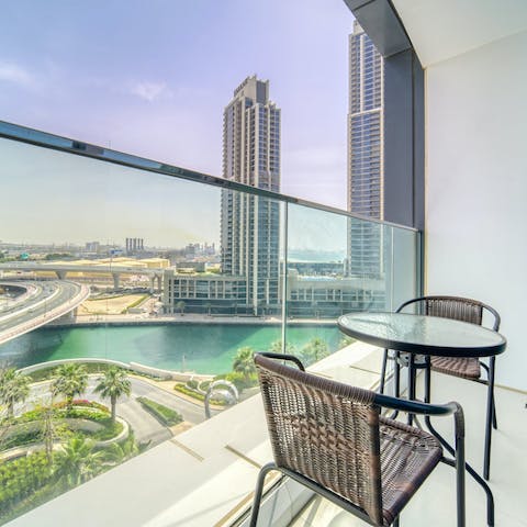 Admire the wonderful views over Dubai from the private balcony