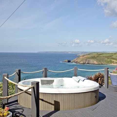 Take in the view of the sea as you soak in your private hot tub, keeping warm as the sun goes down over the ocean