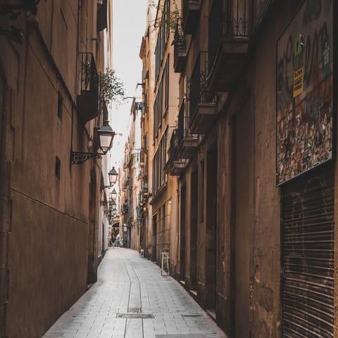Stay in the heart of Barcelona's Gothic Quarter and wander the atmospheric streets