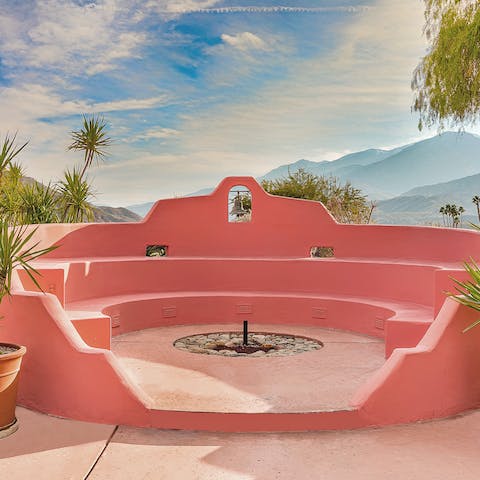 Sit around the amphitheatre-style pink fire pit