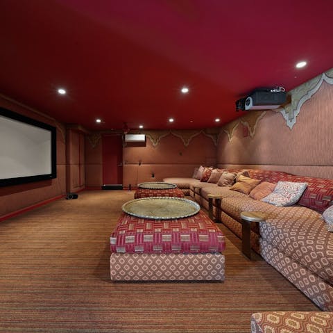 Grab some popcorn and watch a movie in the cinema room